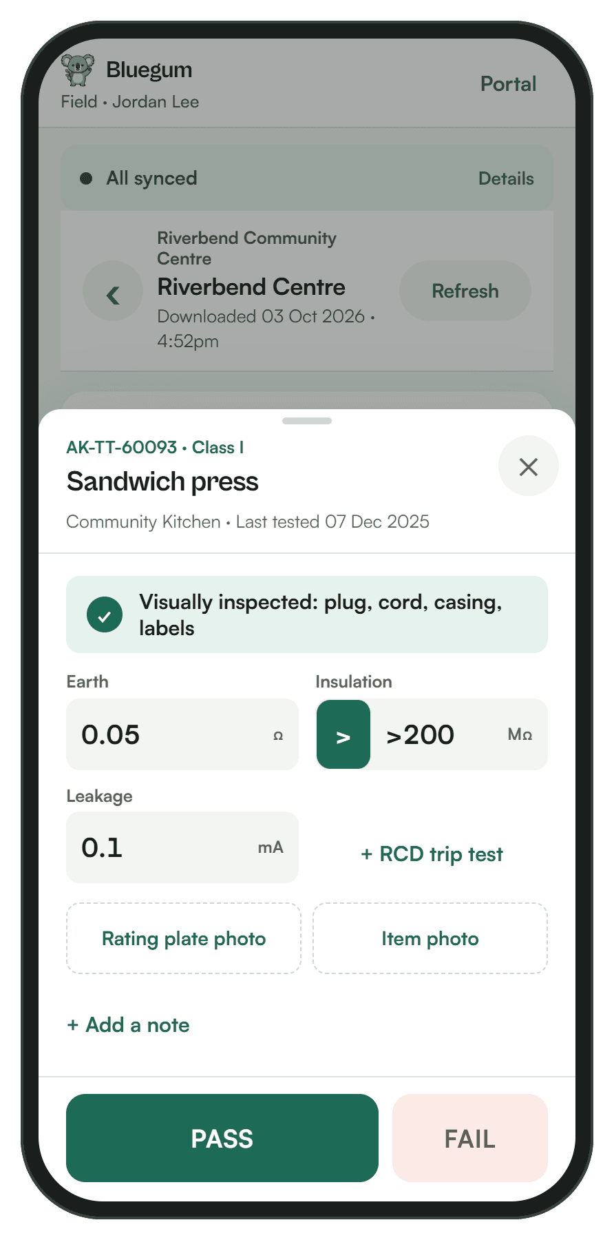 Logging a test in the field app: inspection ticked, readings entered, PASS and FAIL buttons